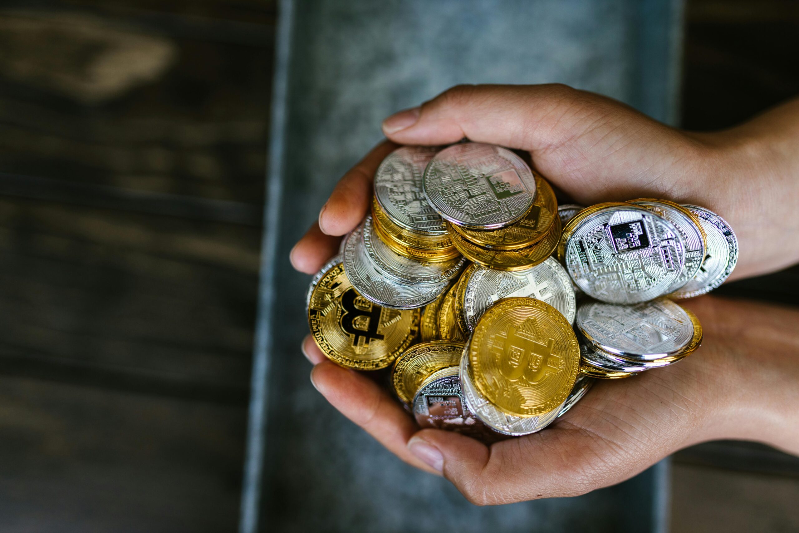 person holding coins in hand